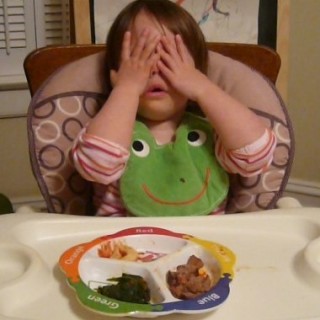 Trying to get me to recite a peek-a-boo- rhyme form school. But I don't know the words!