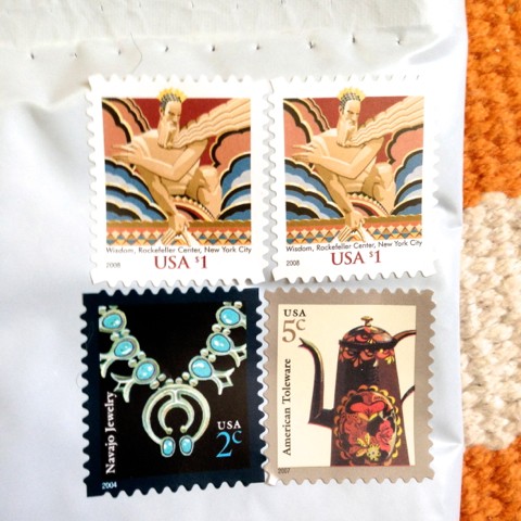 Each package gets 4 stamps. If yours are wildly crooked, it's safe to assume Sasha applied them. She may have even stuck your package in the mailbox herself! 