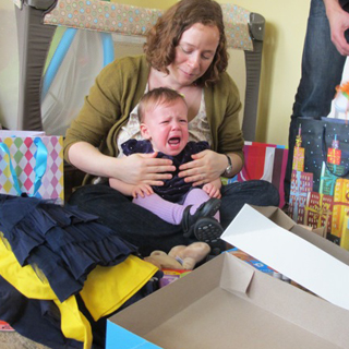 First birthdays are fun! Mountains of presents + a crowd of grownups staring at me is not at all overwhelming.