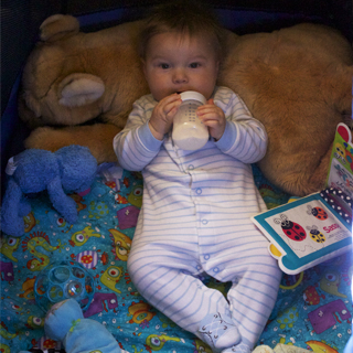 Mace sleeps in his travel crib.