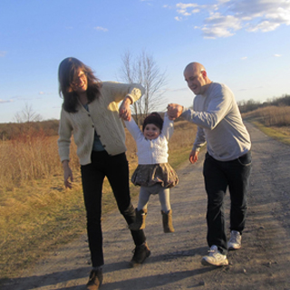 Matt and Hillary hanging out with their friend's child